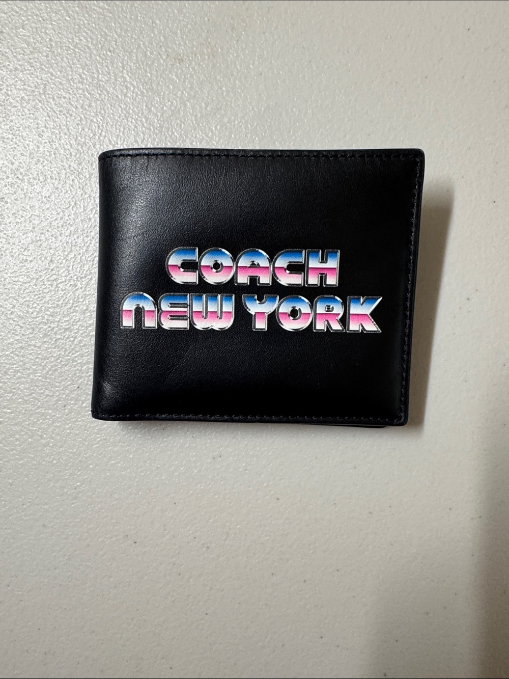 Coach Black Leather Bi-Fold Wallet with Multicolor 'Coach New York' Logo